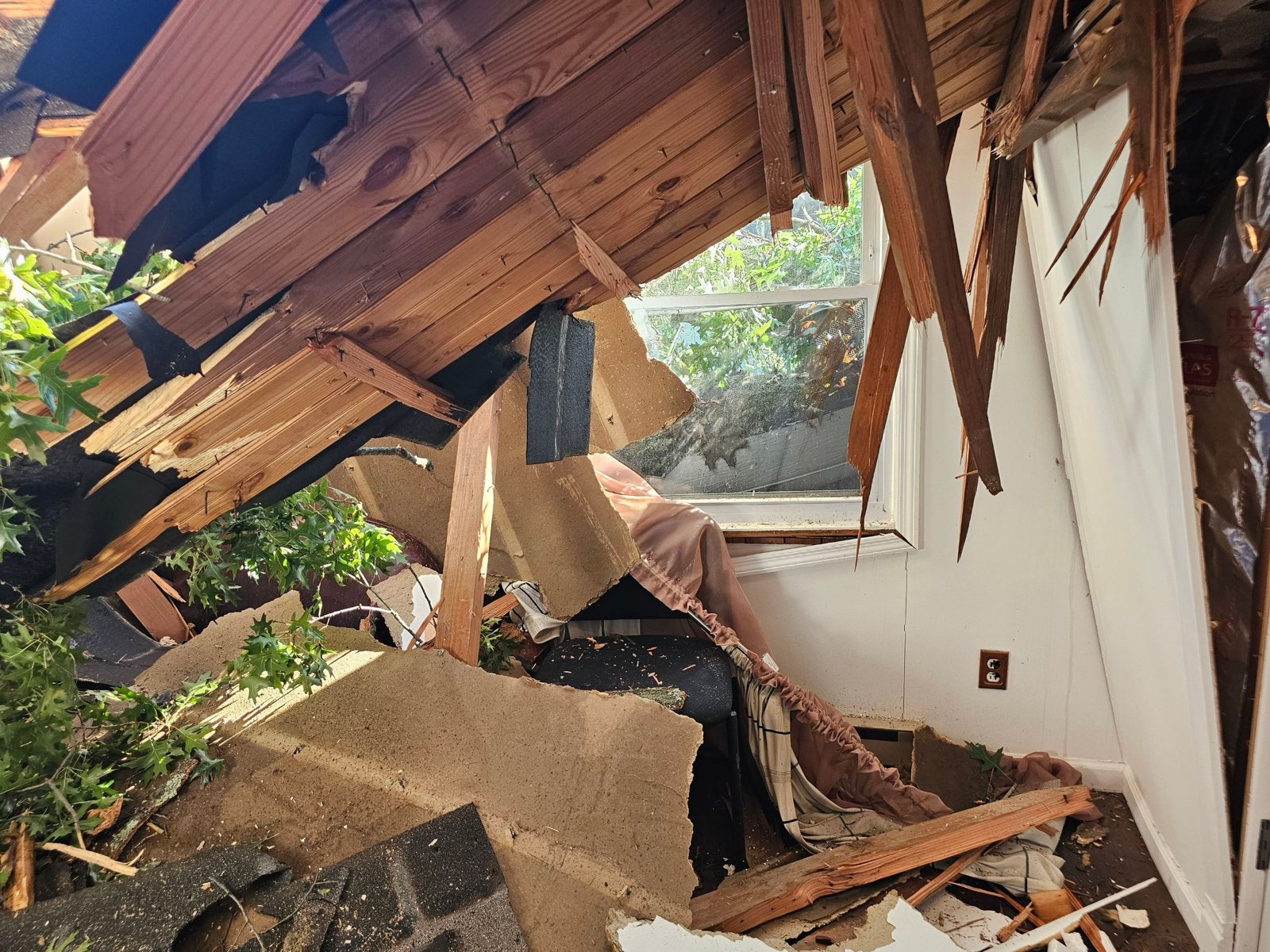 Inside the sunroom: the roof came down with the tree