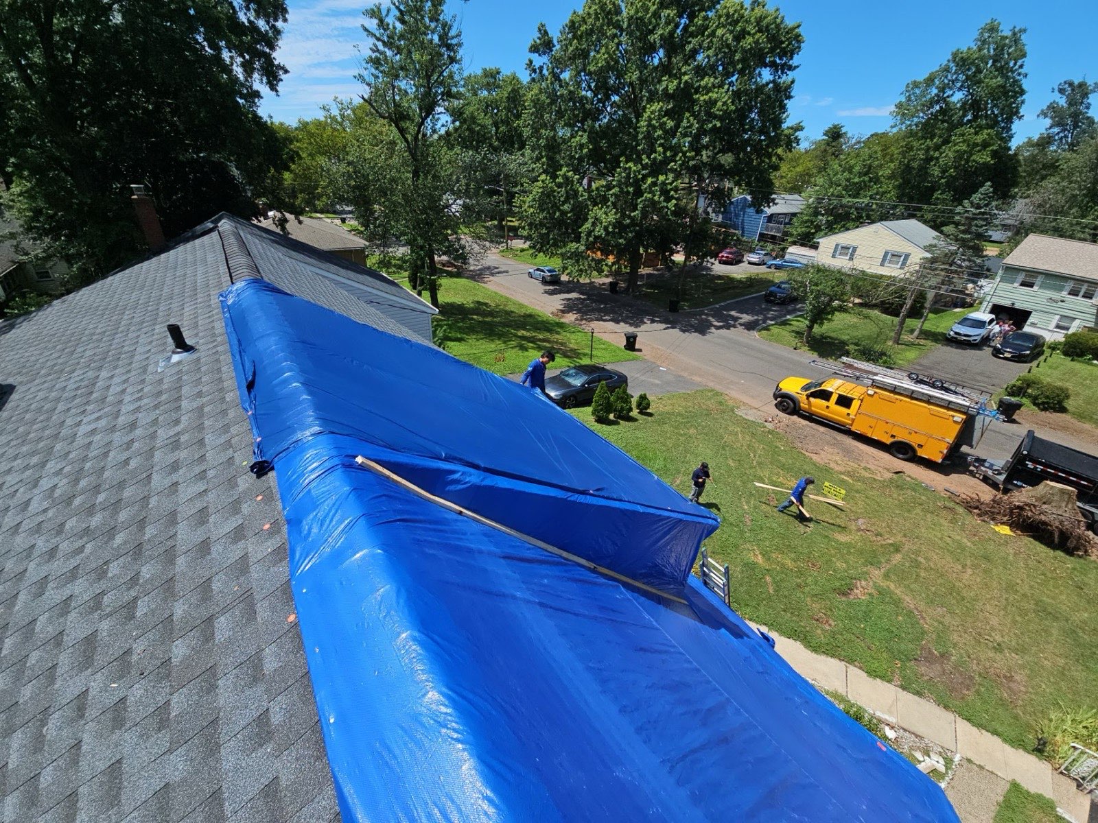 The full ridge sealed under a secured tarp