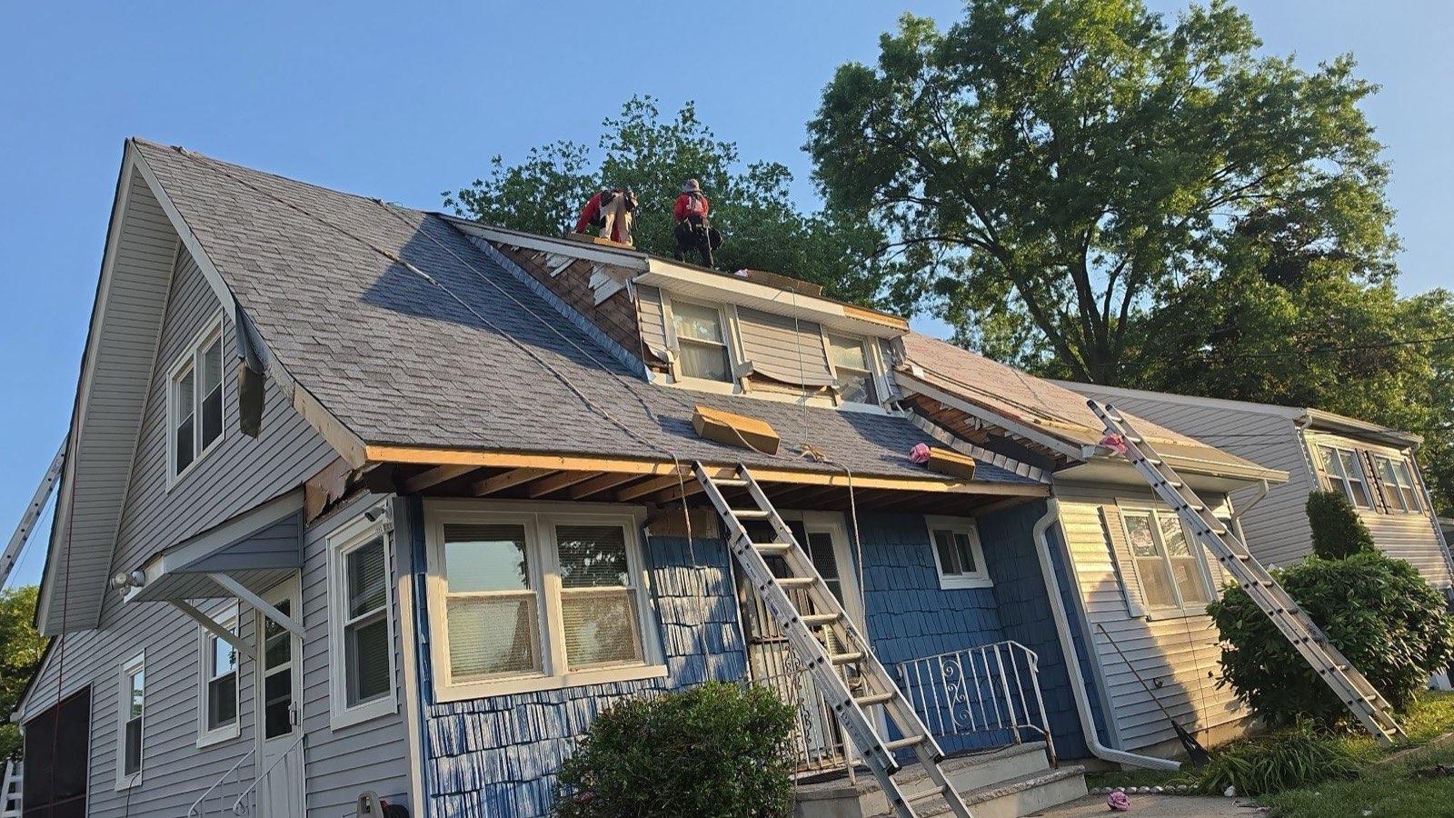 Tear-off and rebuild — including the front overhang framing
